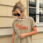 Woman wearing Good Trouble Shirt, Inspirational Graphic Tee, Positive Change T-Shirt, Kindness Shirt, Rebel Spirit Tee, Civil Rights Shirt, Unisex Graphic Tee. Design and copyright by First Row LA