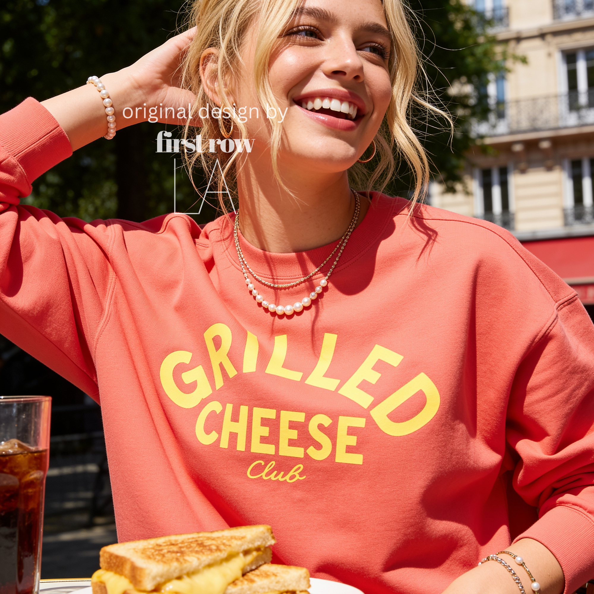 Woman wearing Grilled Cheese Shirt, Club Sweatshirt, Funny Foodie, Comfort Food Shirt, Cheese Lover Gift, Retro Diner Graphic, Unisex Pullover, Y2K Shirt.

Original design and copyright by first row LA 2026.