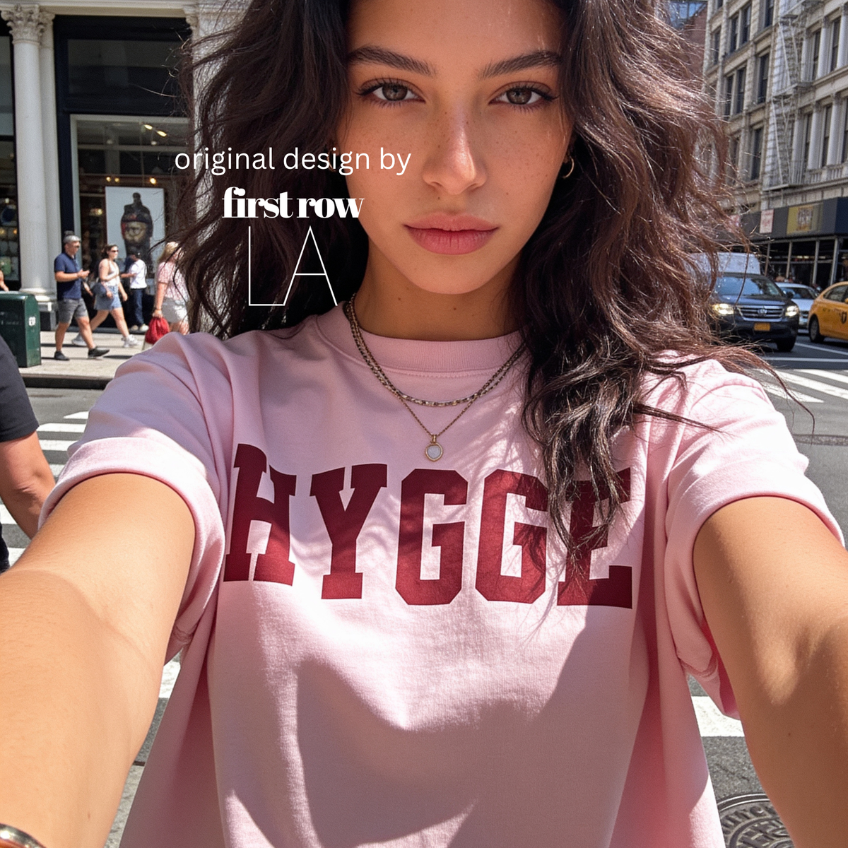 Woman wearing HYGGE T-shirt

Original design and copyright by first row LA 2025