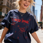Woman wearing I Need Space Shirt, UFO Tee, Space Lover T Shirt, All Over Print, Alien Aesthetic Tee, Cosmic Shirt, Unisex Galaxy Graphic Tee, Introvert T