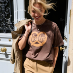 Woman wearing NYC Pretzel T-Shirt, New York Street Food Tee, Distressed Graphic Shirt, Unisex Travel Tee, Funny Foodie Gift, Unisex Big Apple Shirt