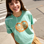 Woman wearing NYC Pretzel T-Shirt, New York Street Food Tee, Distressed Graphic Shirt, Unisex Travel Tee, Funny Foodie Gift, Unisex Big Apple Shirt