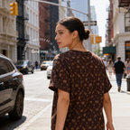Woman wearing New York All Over Print T-Shirt, NYC Pizza Pretzel Graphic Tee, Brown Monogram Style Shirt, Hand Drawn Travel Tee, Streetwear Unisex Gift