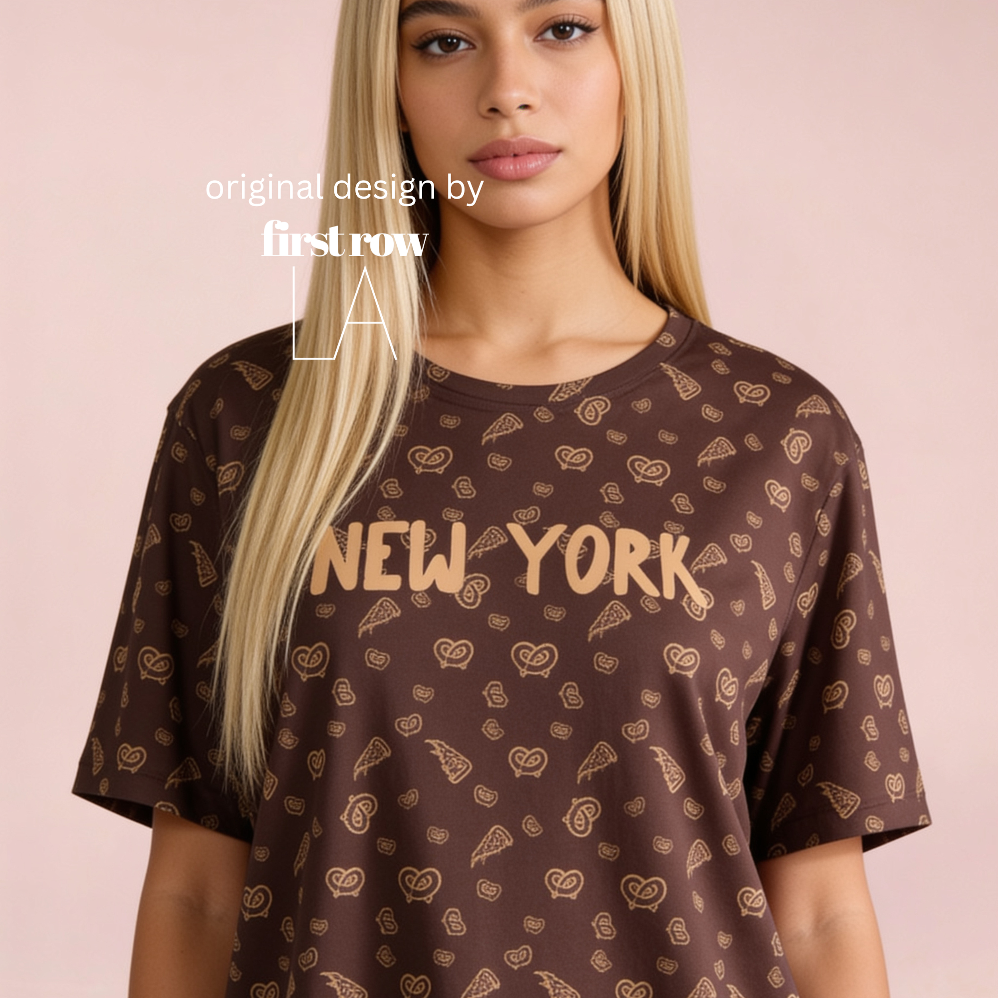 A blonde model wearing a brown oversized t-shirt with a golden pretzel and pizza pattern and 'NEW YORK' printed across the chest, set against a solid pale pink background. Original design by first row LA.