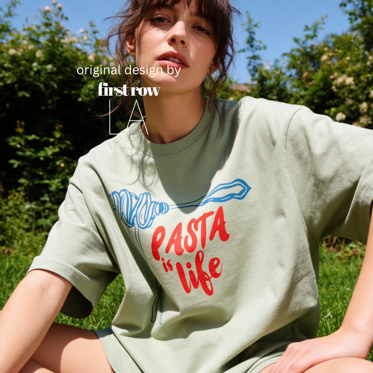 Woman wearing spaghetti on a fork in blue and the words 'PASTA is life' in red. 

Original design and copyright by first row LA 2025.