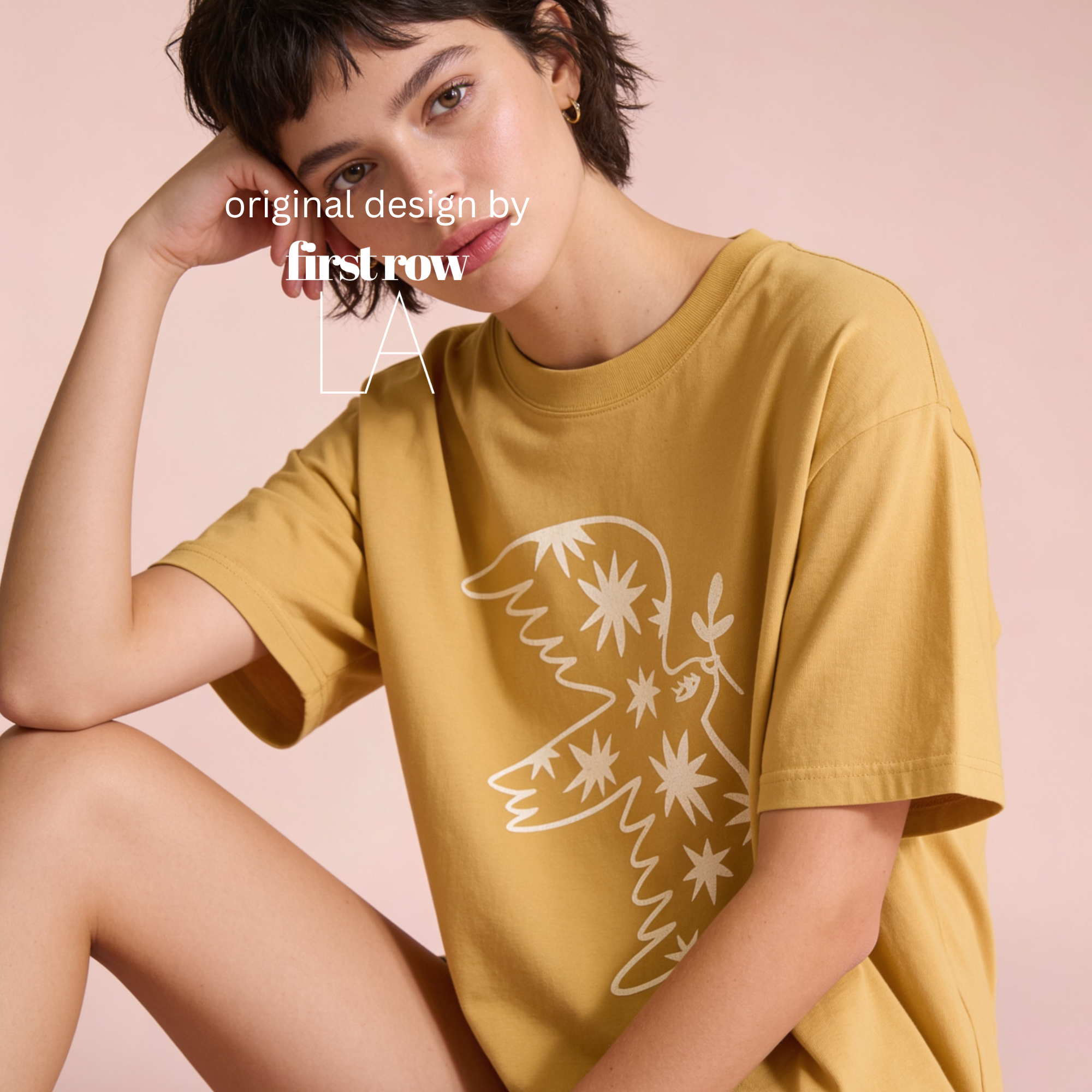 Woman wearing peace dove T-shirt.

Original design by first row LA.