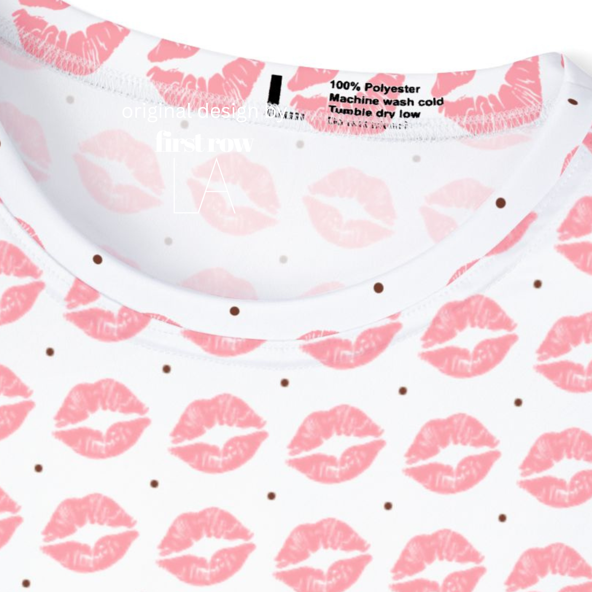 Close-up of a white short-sleeve top with a pink lip and polka dot sprint pattern .

Original design and copyright by first row A.