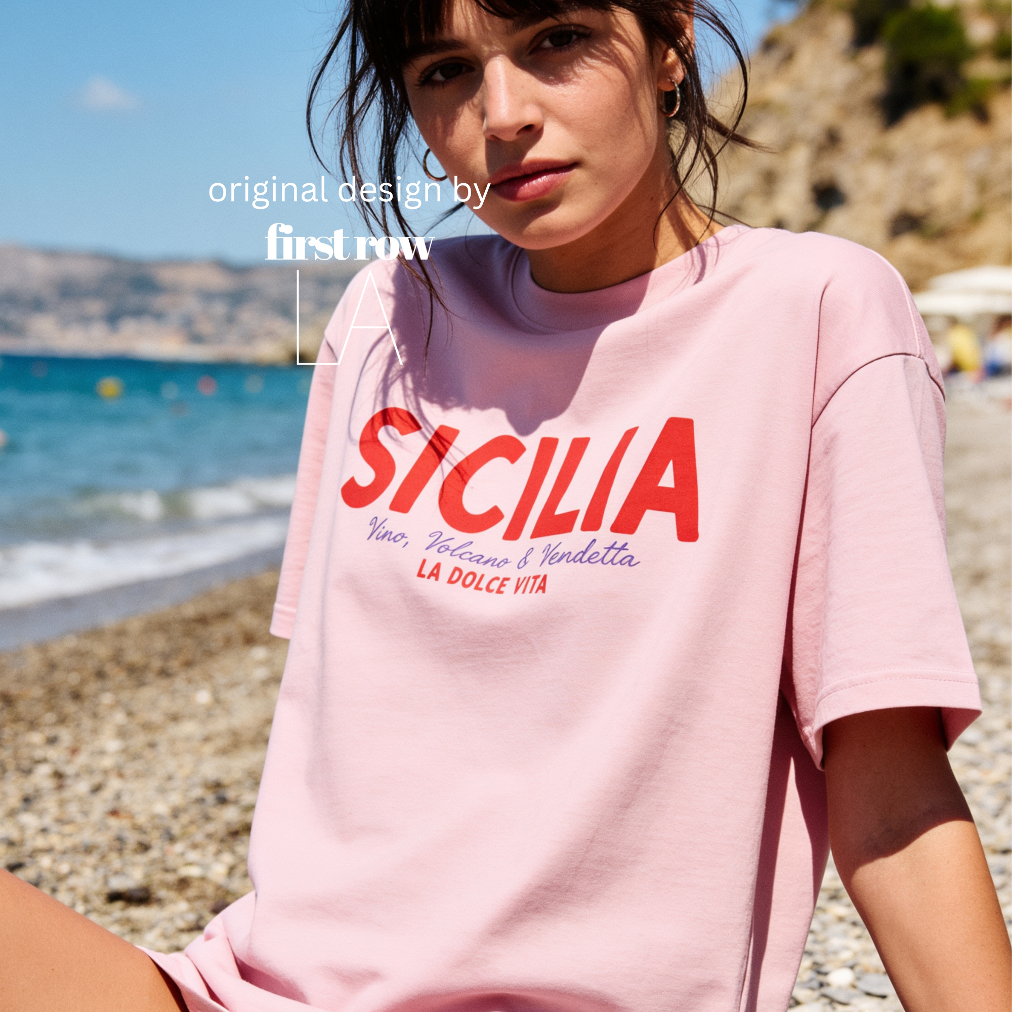 Woman wearing 'SICILIA, Vino, Volcano and Vendetta, LA DOLCE VITA' T-shirt.

Original design and copyright by first row LA 2026.