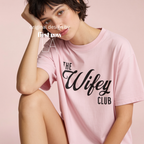Woman wearing The Wifey Club T-shirt.

Original design and copyright by first row LA 2025.