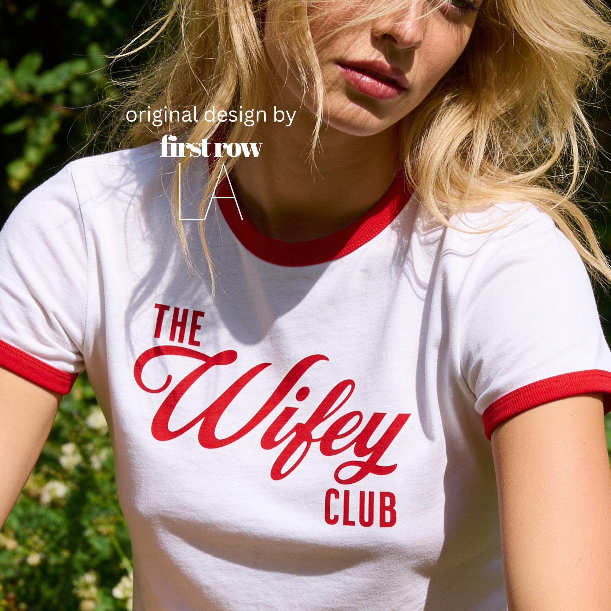 A woman wearing a white cropped ringer T-shirt with red trim and the words 'THE Wifey CLUB' printed in red across the front.

Original design and copyright by first row LA.