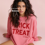 Woman wearing unisex sweatshirt with the text Trick or Treat Crew.

Original design and copyright by first row LA.