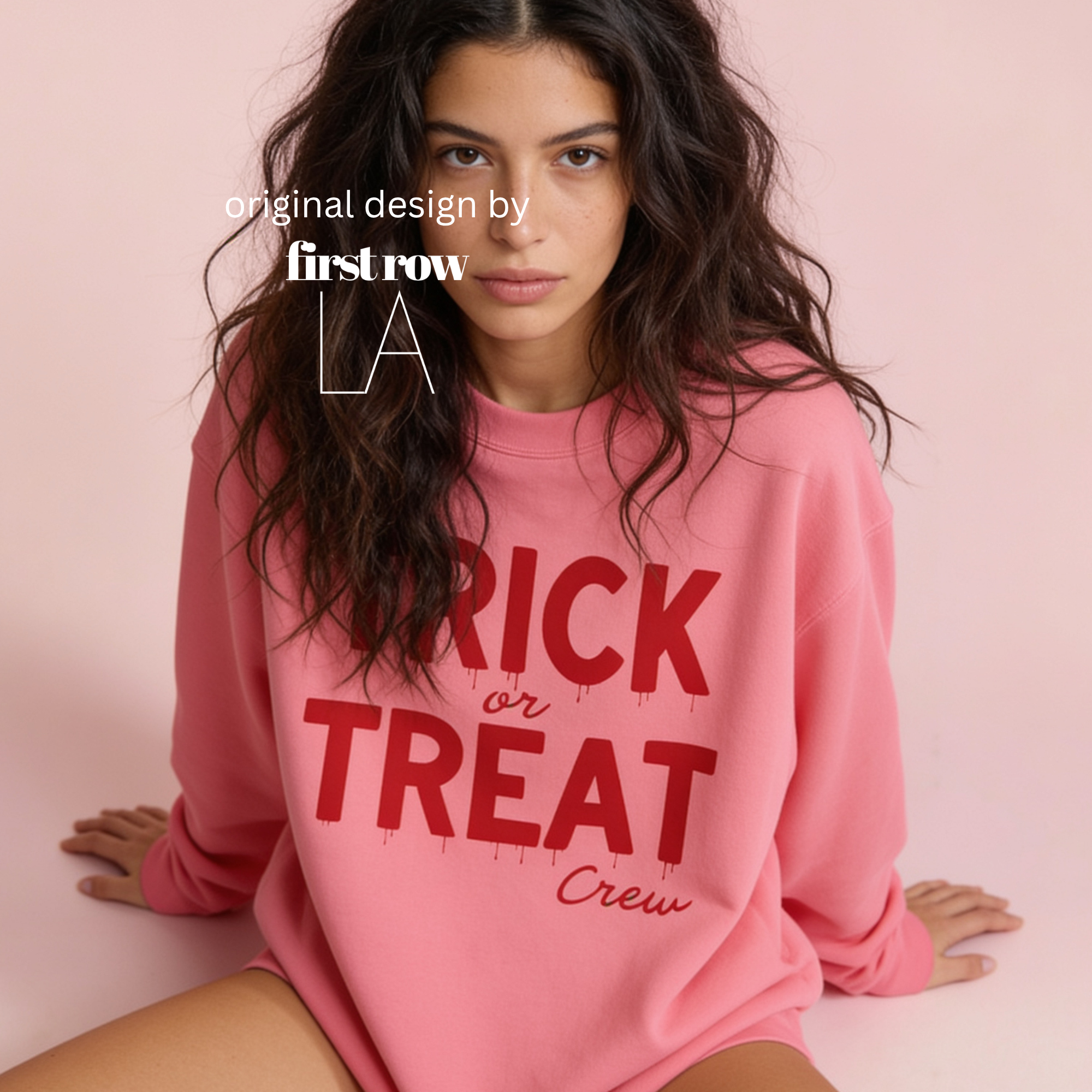 Woman wearing unisex sweatshirt with the text Trick or Treat Crew.

Original design and copyright by first row LA.