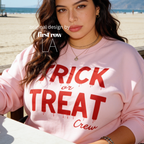 Woman wearing unisex sweatshirt with the text Trick or Treat Crew.

Original design and copyright by first row LA.