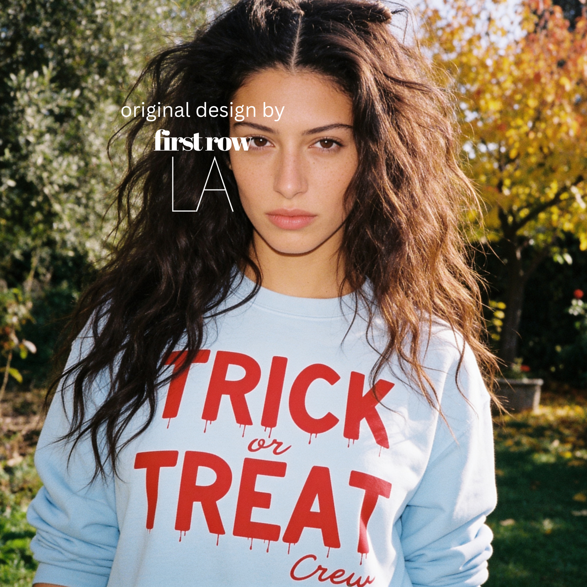 Woman wearing unisex sweatshirt with the text Trick or Treat Crew.

Original design and copyright by first row LA.