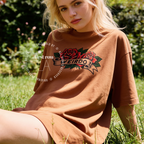 A woman wearing an oversized T-shirt with a red rose graphic and the word 'WEIRDO' 

Original design and copyright by first row LA.