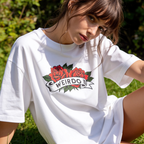 A woman wearing an oversized T-shirt with a red rose graphic and the word 'WEIRDO' 

Original design and copyright by first row LA.