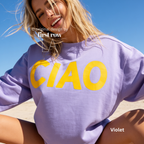 A woman wearing a purple crewneck sweatshirt with large yellow 'CIAO' print.

Original design and copyright by first row LA 2026