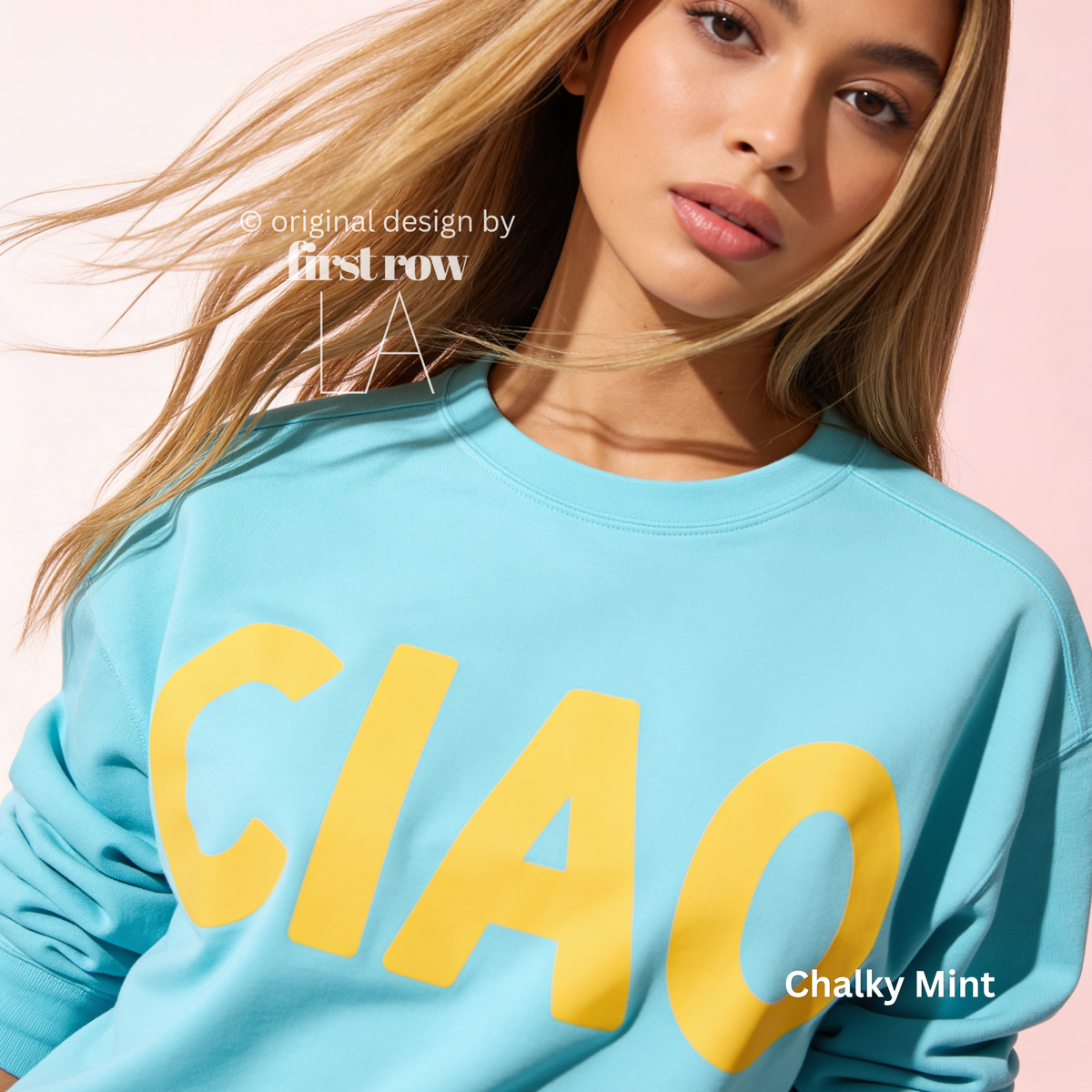 A woman wearing a mint crewneck sweatshirt with large yellow 'CIAO' print.

Original design and copyright by first row LA 2026
