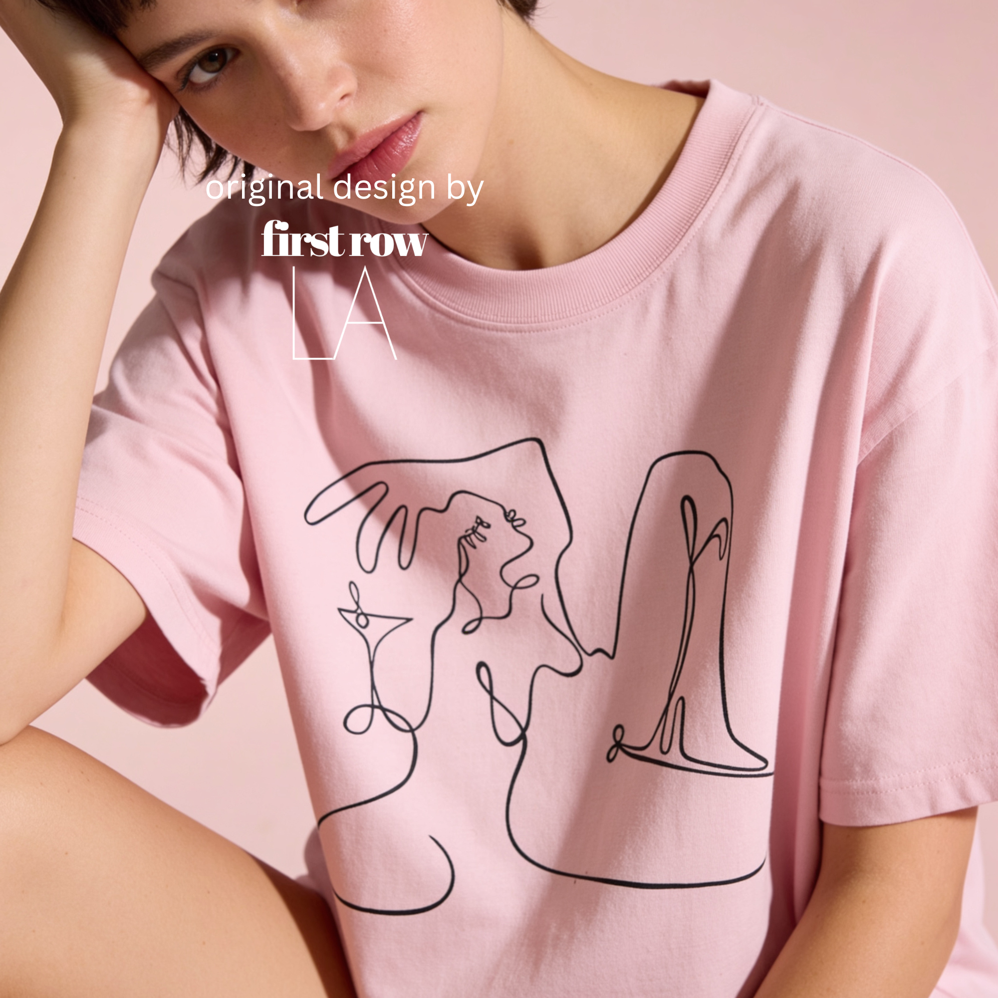 A model with a short blonde bob wears a pale yellow oversized t-shirt featuring a black continuous line art graphic of a woman and her martini.

Original design first row LA.
Copyright lilo on paper 2023.