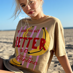 A woman wearing T-shirt with a yellow banana illustration and the text 'THE OLDER YOU GET the BETTER YOU GET UNLESS YOU ARE A banana'.

Original design and copyright by first row LA, August 4th 2026.