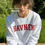 A woman wearing 'HAVNEN' varsity sweatshirt.

Original design and copyright by first row LA.