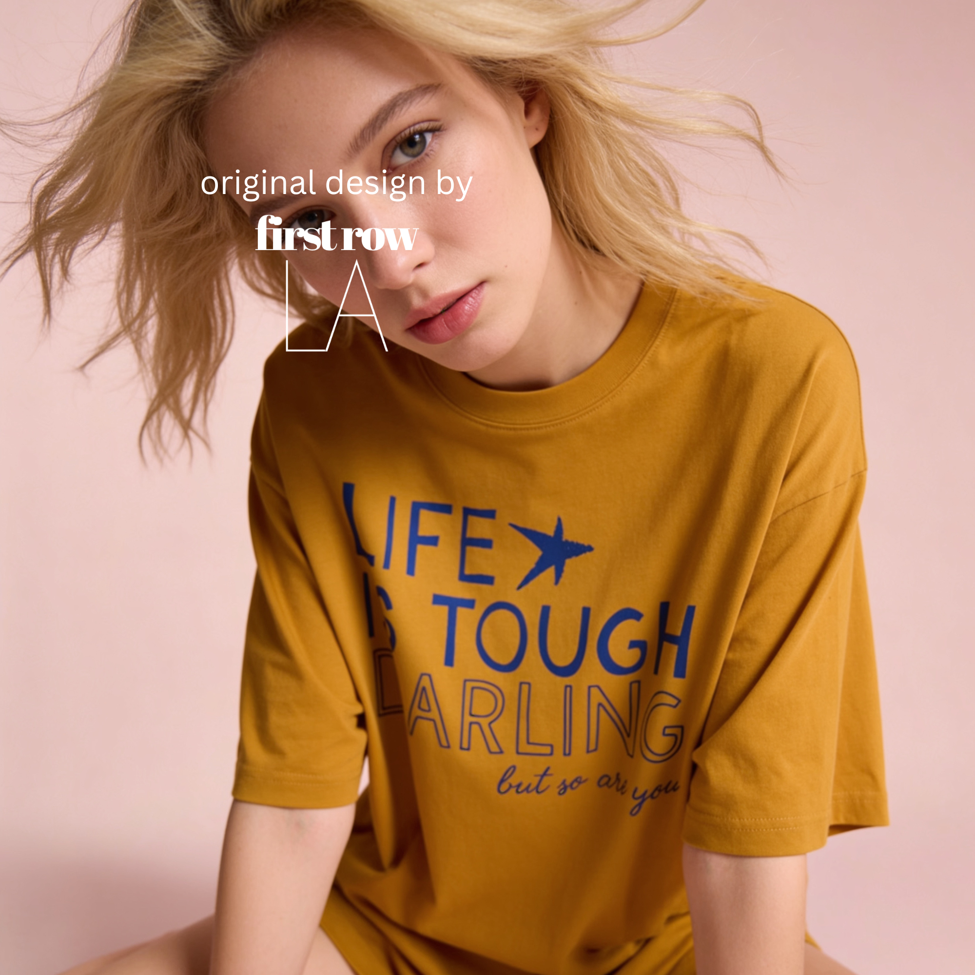 A woman wearing LIFE IS TOUGH DARLING but so are you T-shirt.

Original design and copyright by first row LA 2026.