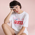 Woman wearing NAP QUEEN T-shirt.  in red and blue with pink clouds.

Original design and copyright by first row LA 2026