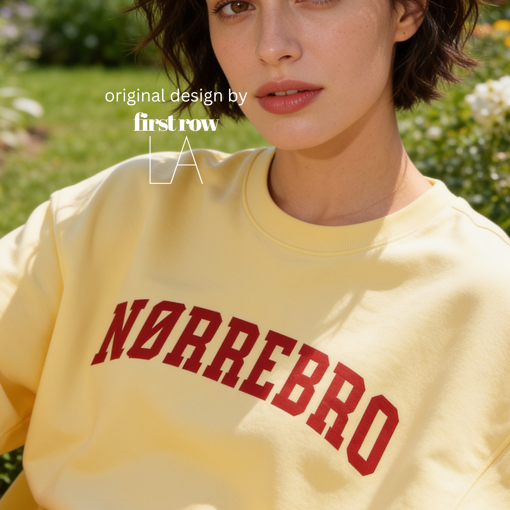 A woman wearing an oversized sweatshirt with 'NØRREBRO' printed across the chest in dark red collegiate lettering.

Original design and copyright by first row LA.