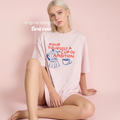 Woman wearing pink POUR YOURSELF A CUP OF AMBITION T-shirt. With blue drawings of a moka pot and a coffee cup.

Original design and copyright by first row LA.