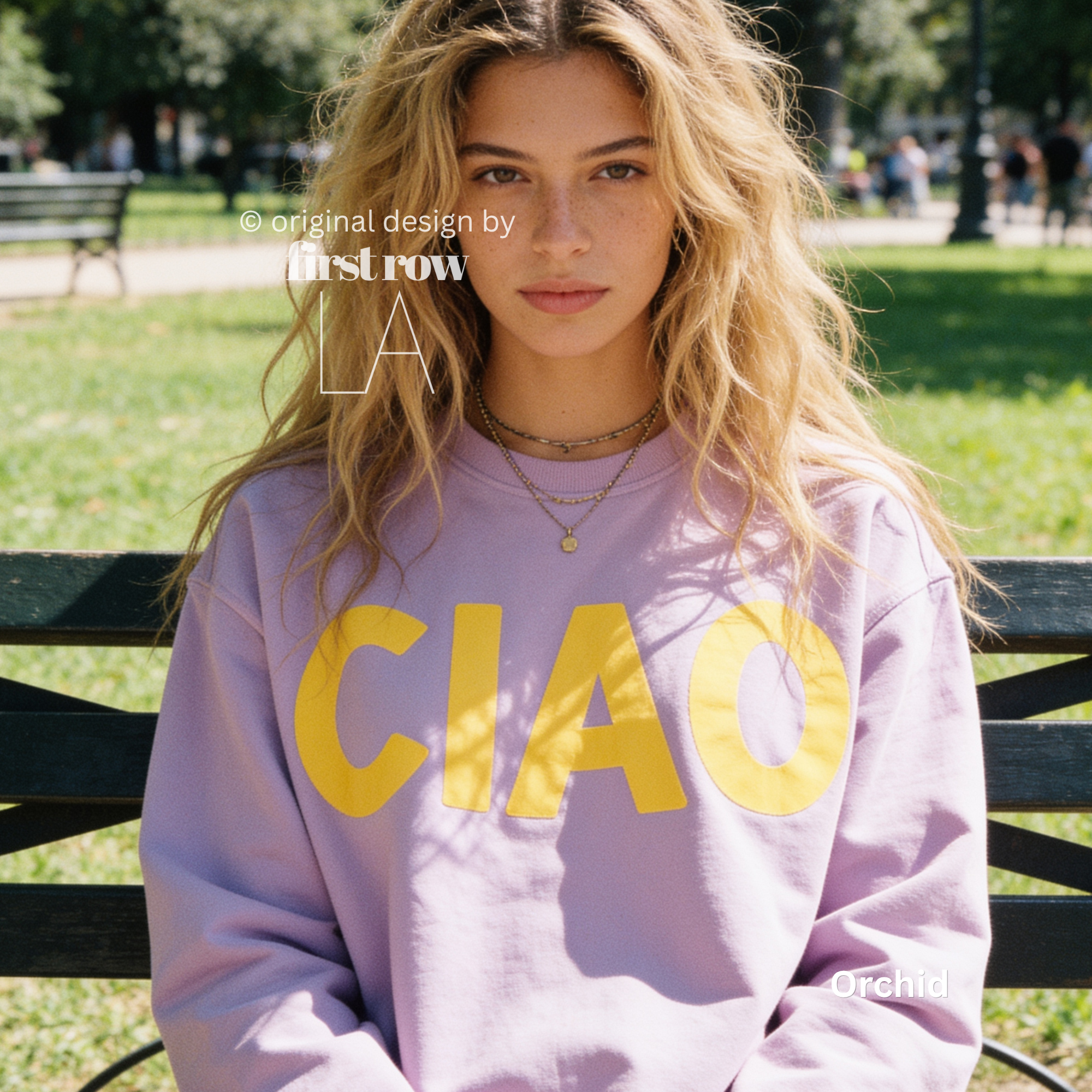 A woman wearing a purple crewneck sweatshirt with large yellow 'CIAO' print.

Original design and copyright by first row LA 2026