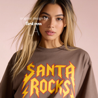 A woman wearing 'SANTA ROCKS' unisex funny Christmas T-shirt.

Original design and copyright by first row LA.
