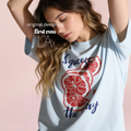 Woman wearing SQUEEZE THE DAY T-shirt, with red citrus fruits.

Design by first row LA 2025.