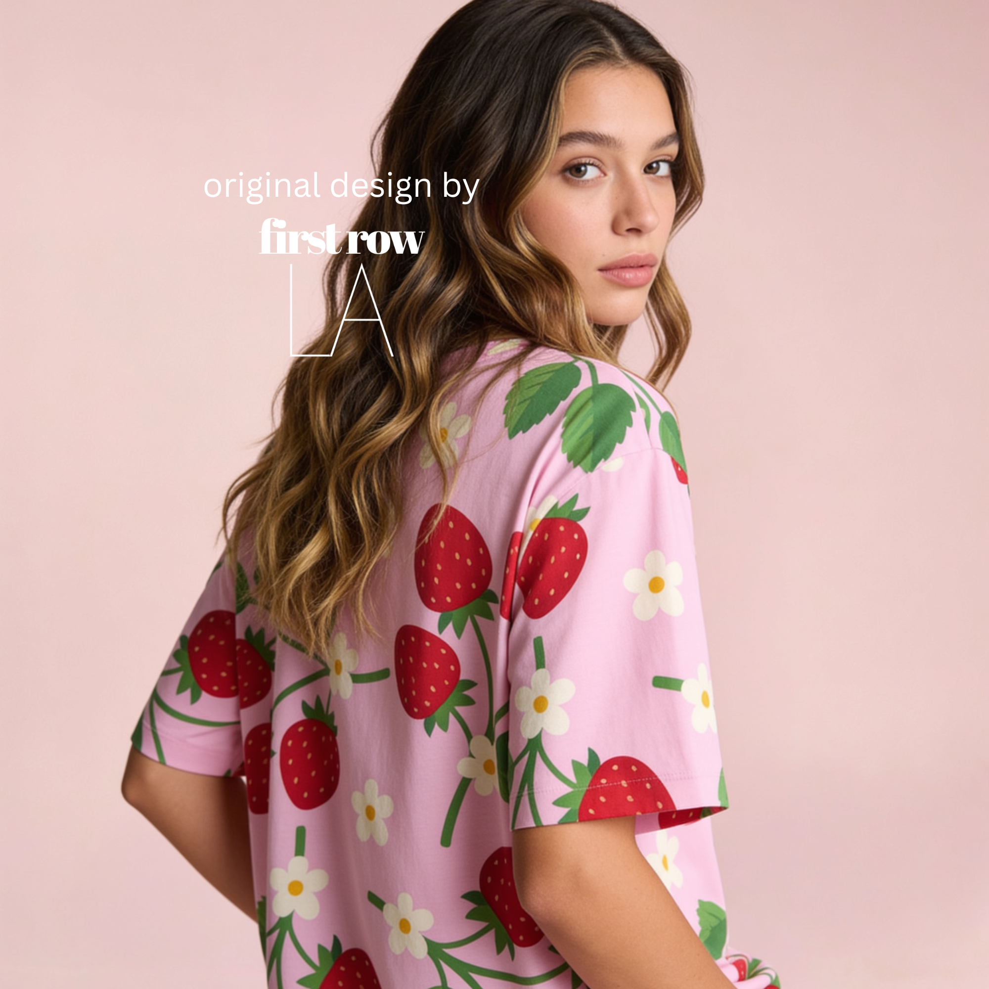 Woman wearing pink T-shirt with strawberries and flowers.

Original design and copyright by first row LA.