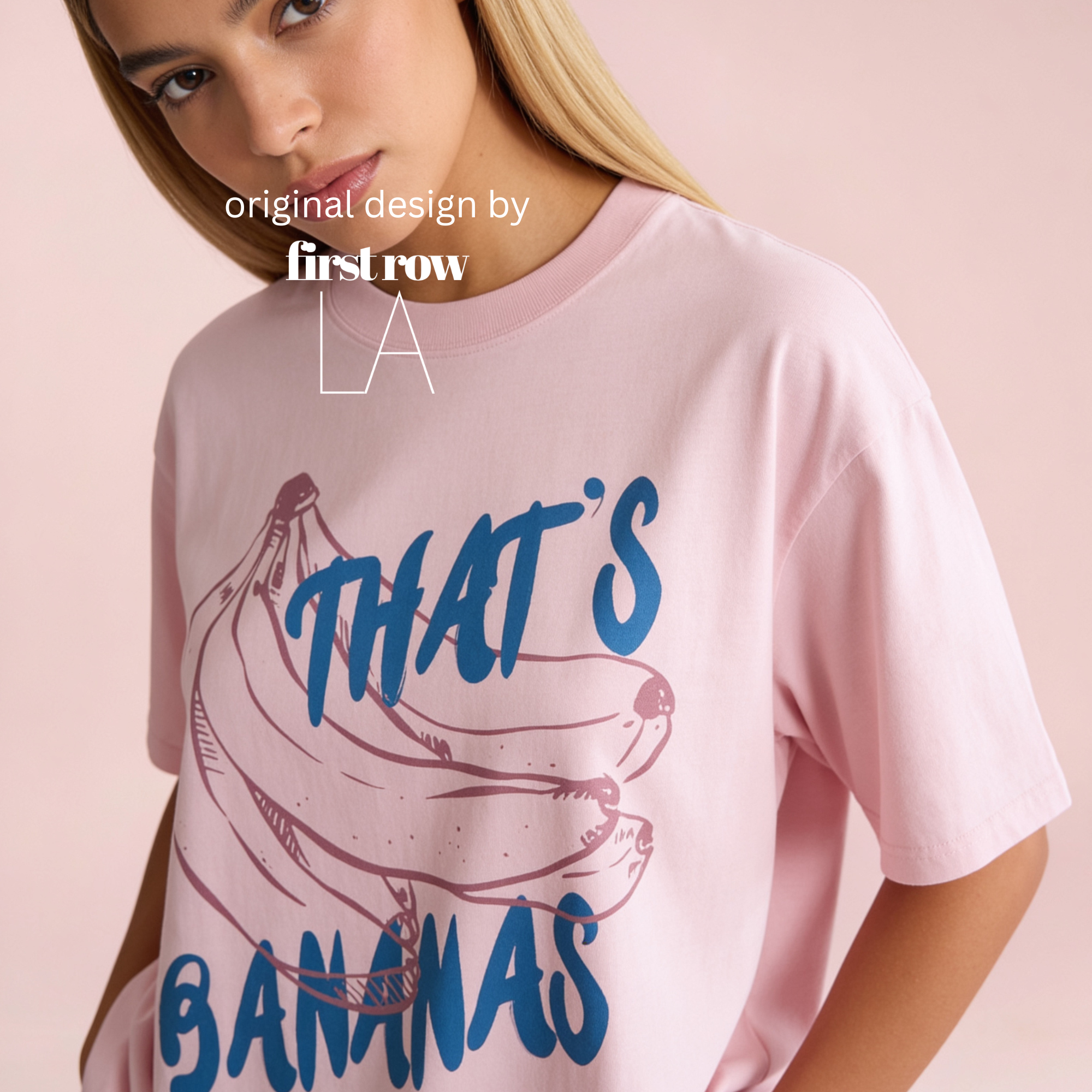 A woman wearing a light pink oversized T-shirt with a blue and pink graphic of bananas and the text 'THAT'S BANANAS'. 

Original design by first row LA.