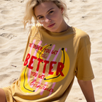 A woman wearing T-shirt with a yellow banana illustration and the text 'THE OLDER YOU GET the BETTER YOU GET UNLESS YOU ARE A banana'.

Original design and copyright by first row LA, August 4th 2026.