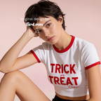 Woman wearing a white ringer crop top with red trim and 'TRICK or TREAT Crew' printed in red dripping text.

Original design and copyright by first row LA.