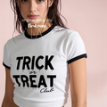 A woman wearing a white ringer T-shirt with black trim and a black graphic that reads 'TRICK or TREAT Club' in a dripping font.

Original design and copyright by first row LA.