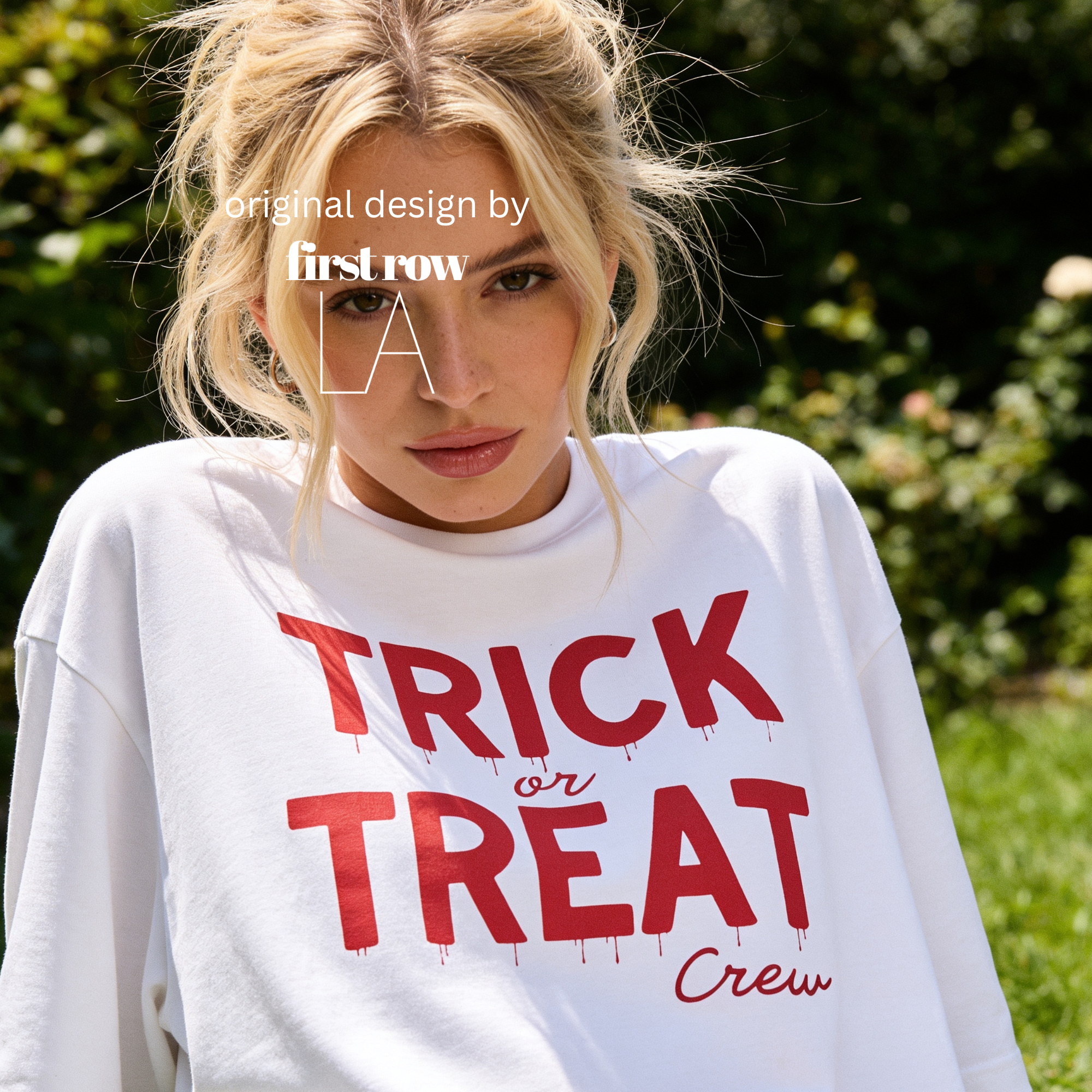Woman wearing crewneck T-shirt with 'TRICK or TREAT Crew' printed in dark red across the front.

Original design and copyright by first row LA.