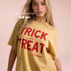 Woman wearing crewneck T-shirt with 'TRICK or TREAT Crew' printed in dark red across the front.

Original design and copyright by first row LA.