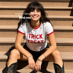 Woman wearing a white ringer crop top with red trim and 'TRICK or TREAT Crew' printed in red dripping text.

Original design and copyright by first row LA.