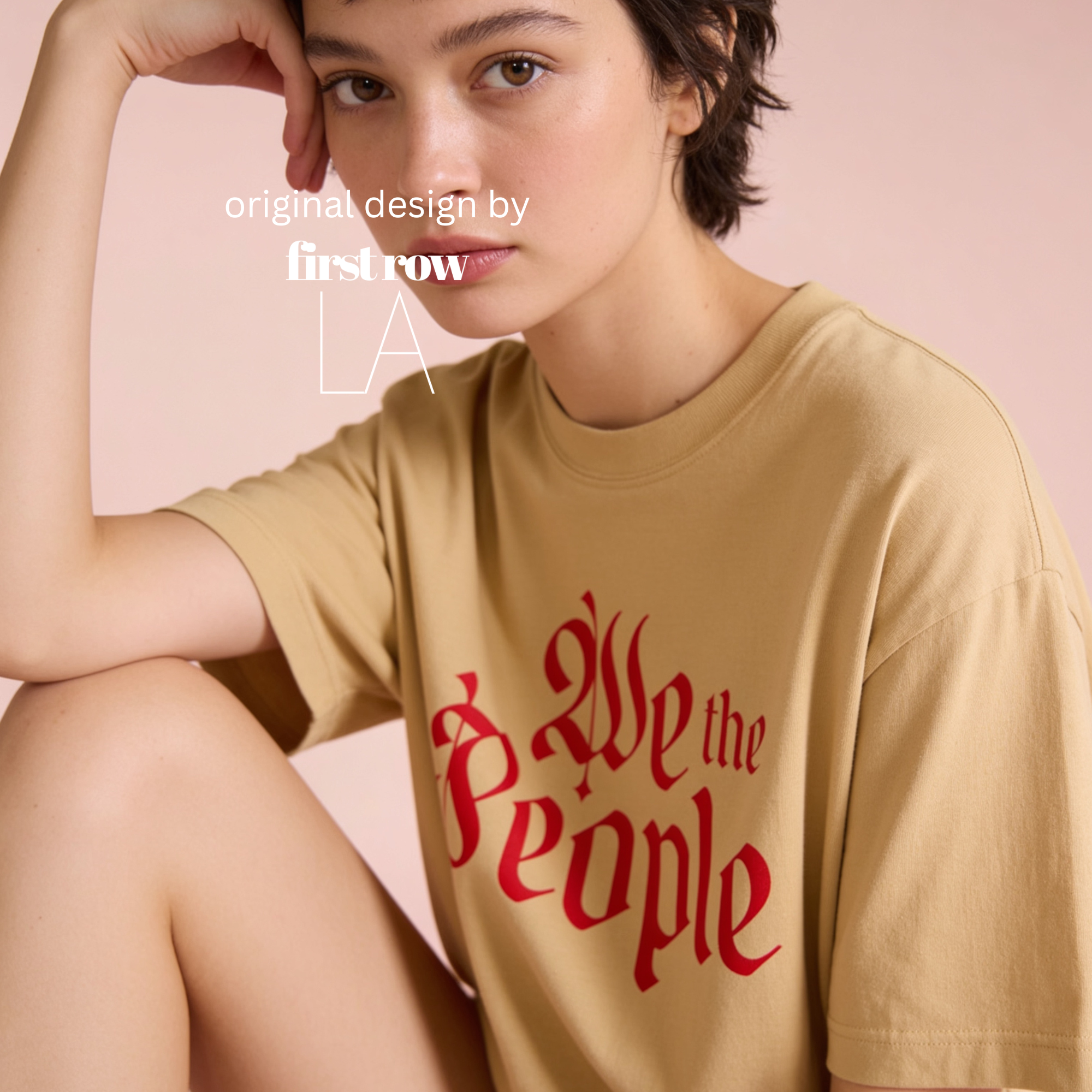 Woman wearing a mustard oversized t-shirt with 'We the People' printed in red gothic lettering.

Original design and copyright by first row LA.