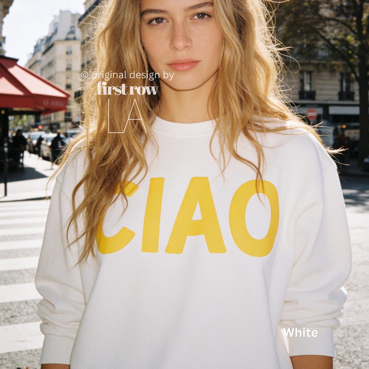 A woman wearing a white crewneck sweatshirt with large yellow 'CIAO' print.

Original design and copyright by first row LA 2026