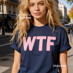 A woman wearing a dark blue T-shirt with large pink 'WTF' print.

Original design and copyright by first row LA 2026.